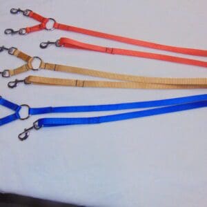 A group of five different colored lanyards.