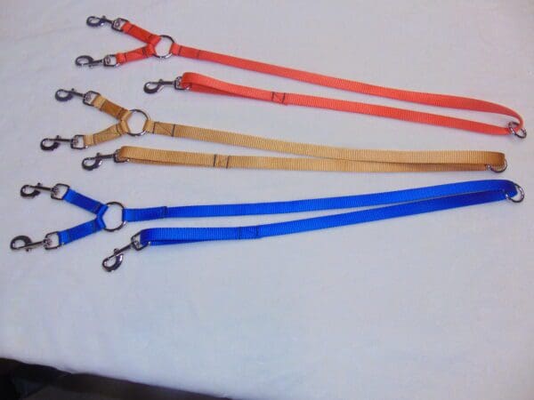 A group of five different colored lanyards.