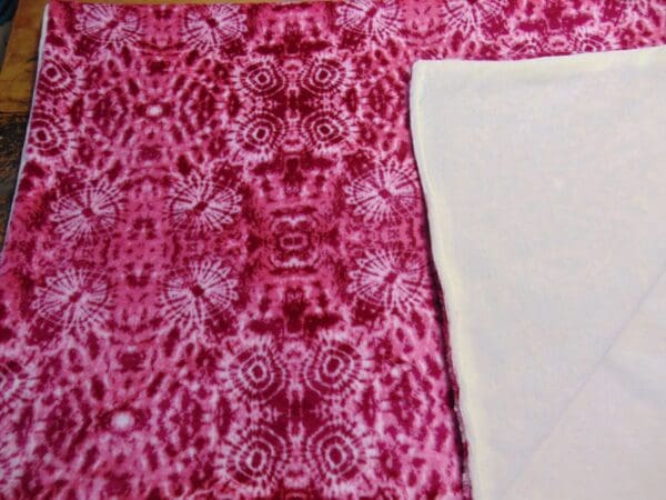 A close up of the fabric on a bed