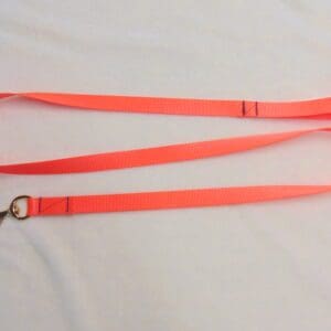 A neon orange lanyard with a metal ring.